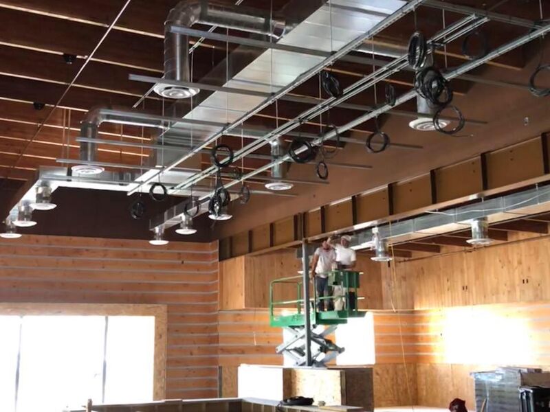 Exposed mechanical systems in a restaurant interior